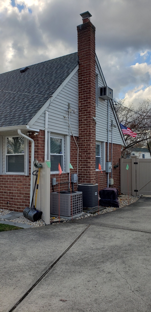 Professional chimney repointing restoring brick joints in West Babylon, NY