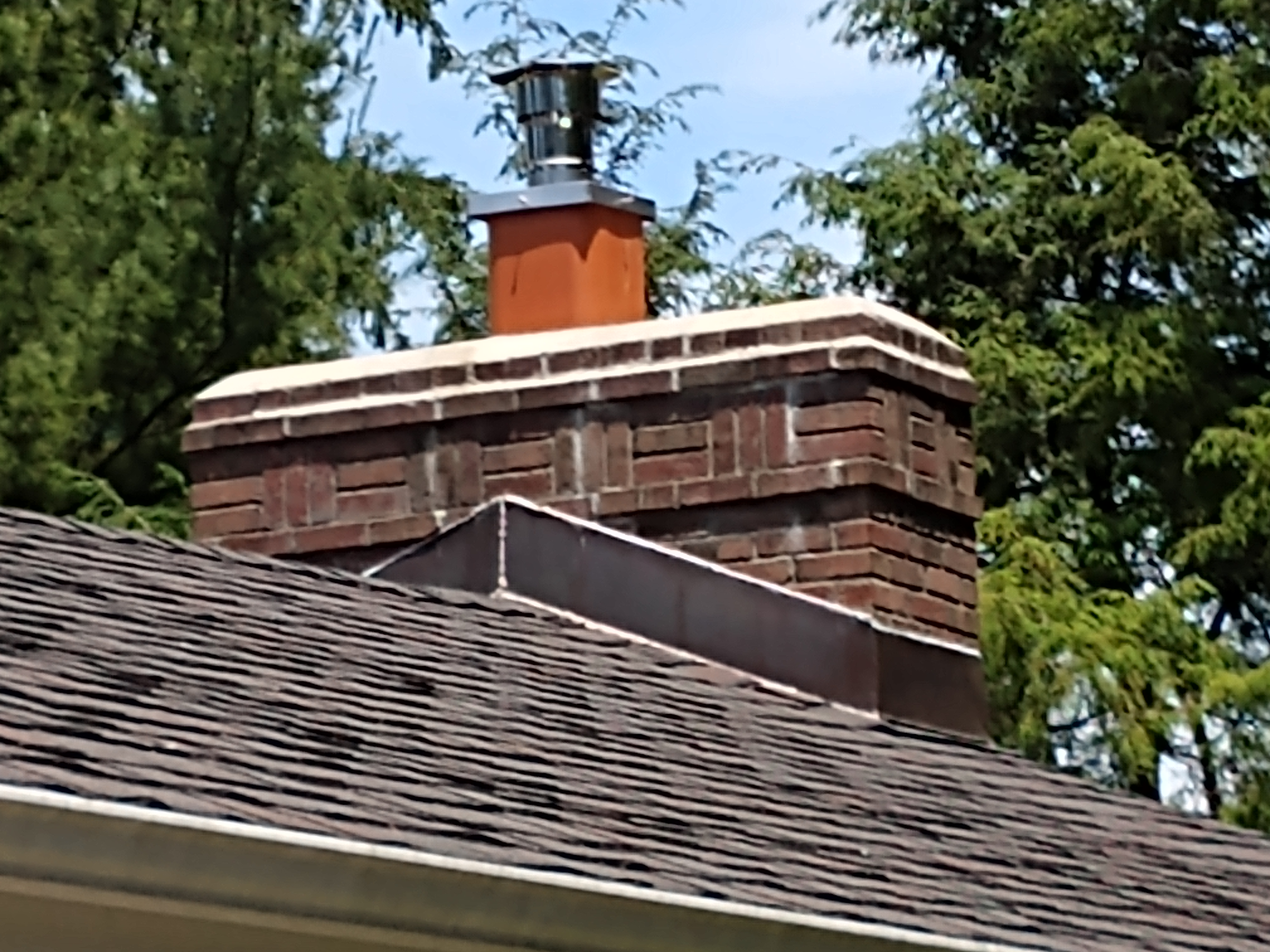 Stainless steel chimney cap with animal guard in West Babylon, New York